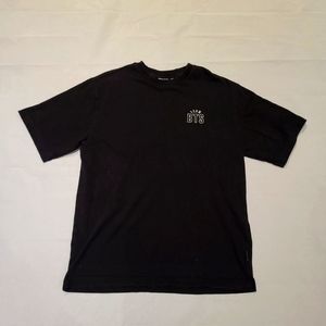 BTS band shirt.